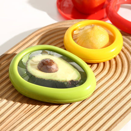 Avocado with a green lid on a wooden surface