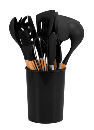 Set of black kitchen utensils in a black holder on a white background