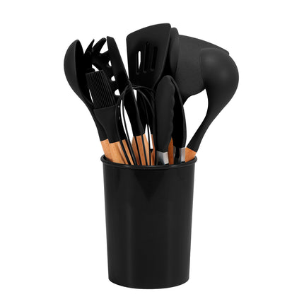 Set of black kitchen utensils in a black holder on a white background