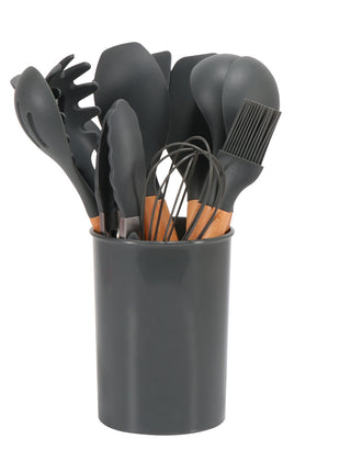 Set of black kitchen utensils including spoons, spatulas, and a whisk in a gray holder on a white background.