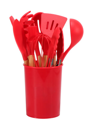 Set of red kitchen utensils in a red container on a white background