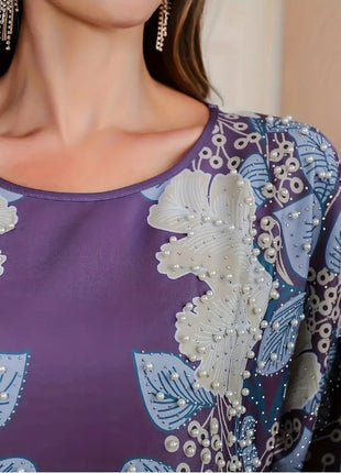 فستان أنيق بأكمام طويلة ومزين بنقشة الزهور