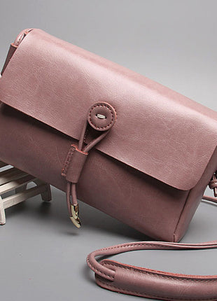 حقيبة يد كورية بكتف مزينة بأزرار جلدية