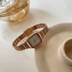 Rose Gold Strap White Surface