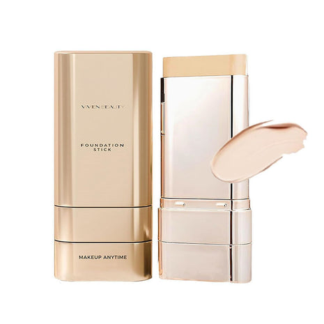 Gold foundation stick with packaging on a white background
