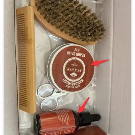 Grooming kit with brush, bottle, and container in a box