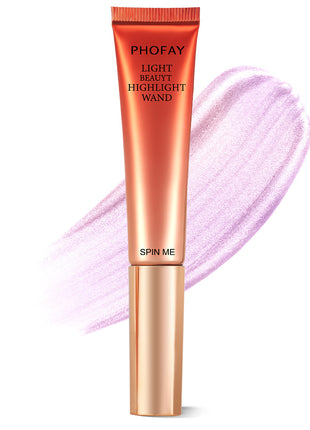 A PHOFAY Highlighter Wand in a golden bronze shade, with a swatch of the product showing its luminous and creamy texture.