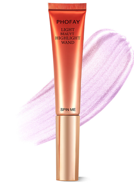A PHOFAY Highlighter Wand in a golden bronze shade, with a swatch of the product showing its luminous and creamy texture.