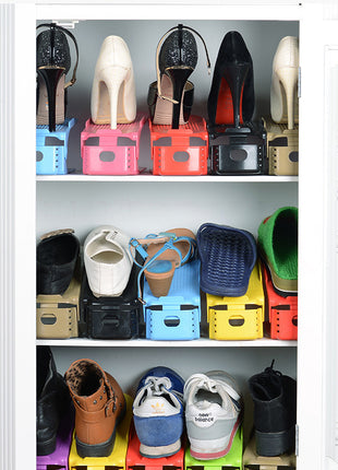 Shelves with various shoes on colorful stands against a white background