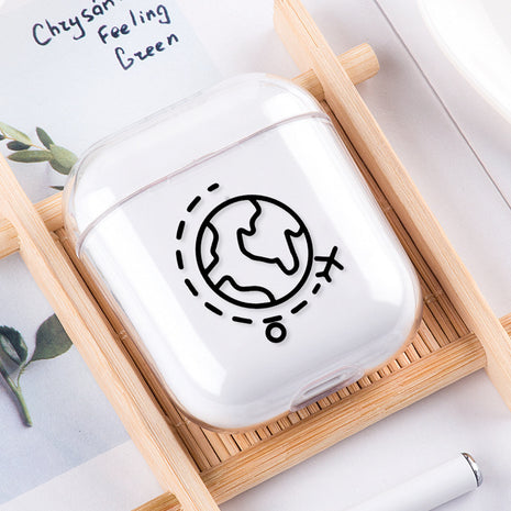 White air pod case with black design on a wooden tray