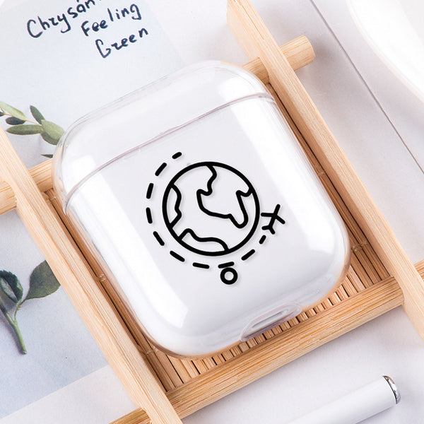 White air pod case with black design on a wooden tray
