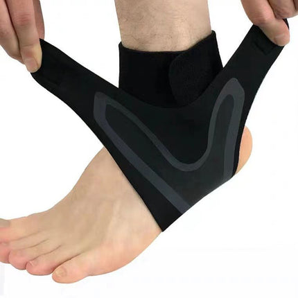Black ankle support brace being worn on a foot against a white background