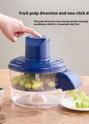 Fruit pulping device with grapes on a wooden table, showing pulp diversion ring feature.