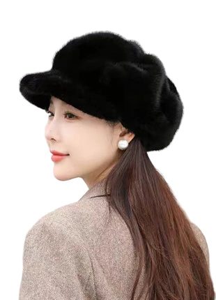 Woman wearing a black fur hat with a neutral background