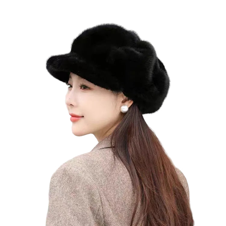 Woman wearing a black fur hat with a neutral background