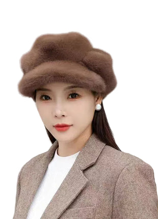 Woman wearing a brown fur hat and coat against a light background