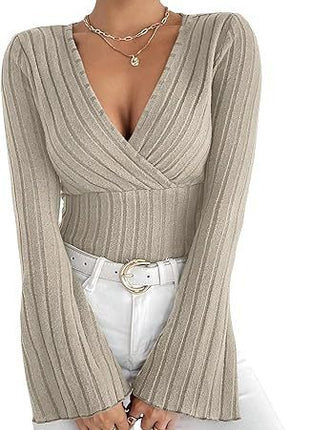 Beige ribbed sweater worn by a person on a white background