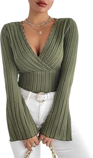 Green ribbed long-sleeve top worn by a person on a white background