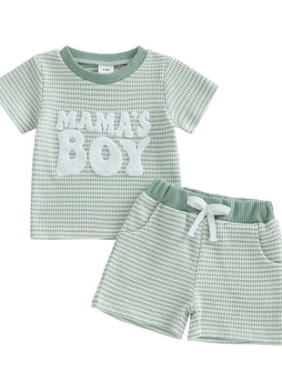 Children's green checkered outfit with 'Mama's Boy' text on a white background