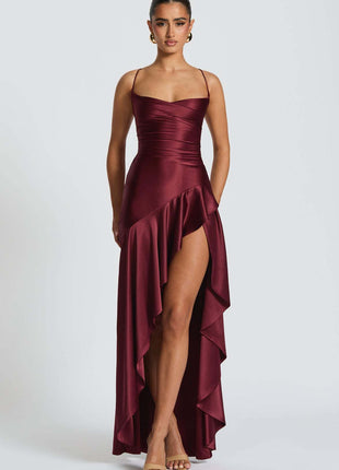 Burgundy evening gown with a high slit on a white background