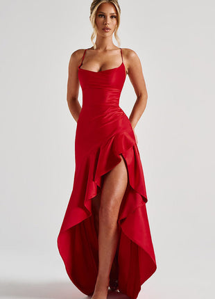 Woman wearing a red dress with a high-low hem on a white background