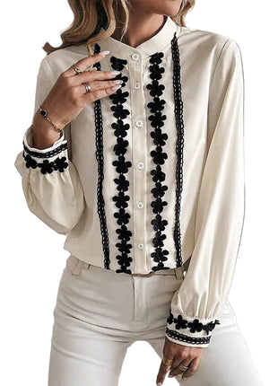 Beige and black button-front cardigan shirt paired with tailored trousers for a smart-casual outfit.