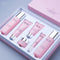 Cosmetic set with pink bottles and containers in a box, featuring the brand 'Belay'.