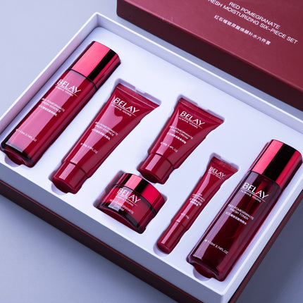 Set of red skincare products with 'BELAY' branding in a box.