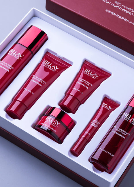 Set of red skincare products with 'BELAY' branding in a box.