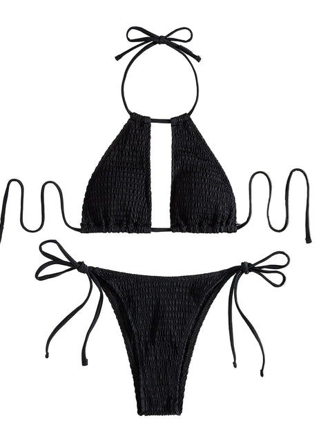 Black bikini set with smocked texture on a textured white background