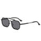 Black sunglasses with a hexagonal frame on a white background