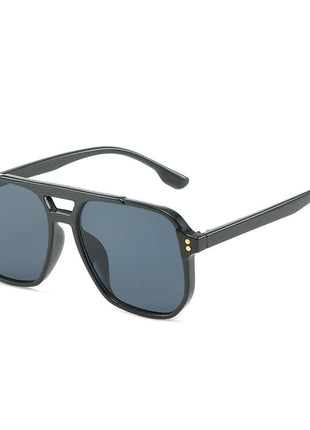 Black sunglasses with dark lenses on a white background