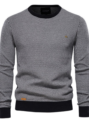 Gray patterned sweater with black accents on a white background