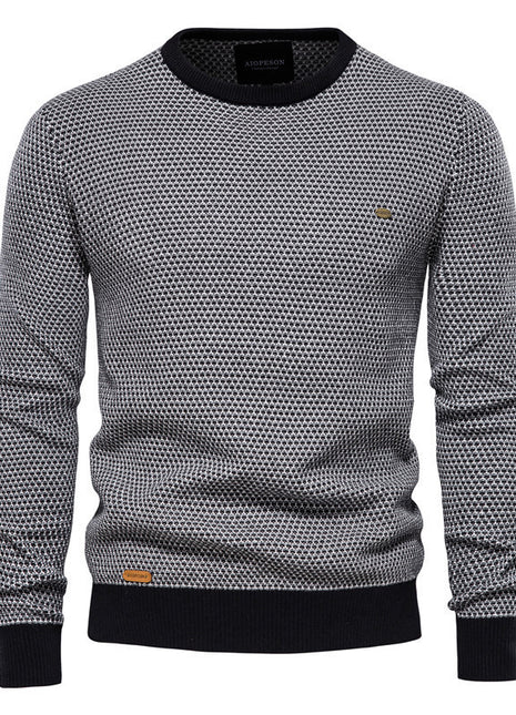 Gray patterned sweater with black accents on a white background