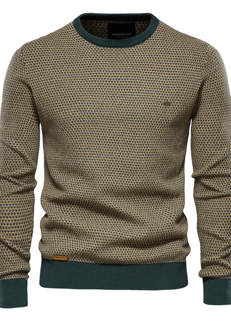 Patterned sweater with green trim on a white background