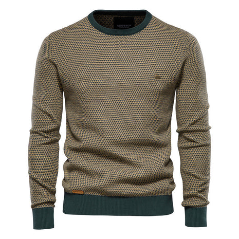 Patterned sweater with green trim on a white background