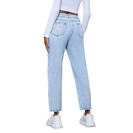 Casual women’s distressed denim pants featuring ripped details and relaxed straight-leg fit.