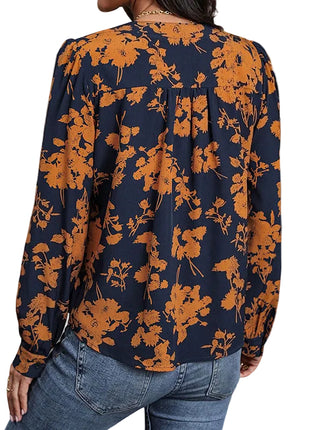 Casual pullover top with a botanical leaf pattern, straight fit, and lightweight polyester construction.
