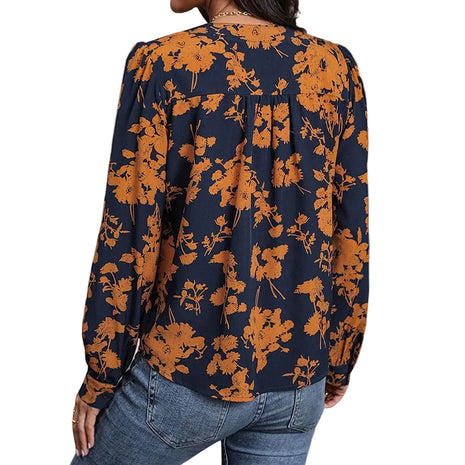 Casual pullover top with a botanical leaf pattern, straight fit, and lightweight polyester construction.