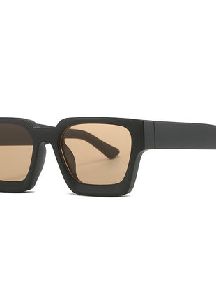 Black sunglasses with brown lenses on a white background