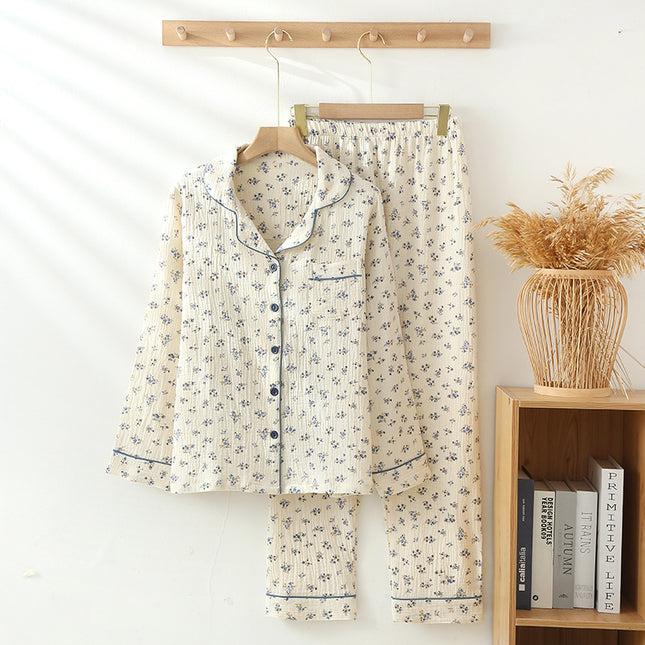 Floral pajama set hanging on a rack with a wooden shelf and books in the background.