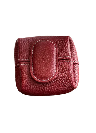 Colorful women's leather coin pouch available in multiple solid color options.