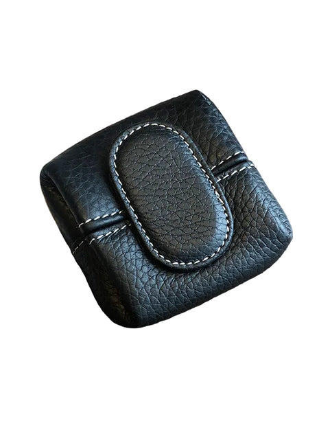 Compact first layer cowhide leather mini purse for coins, keys, and small essentials.