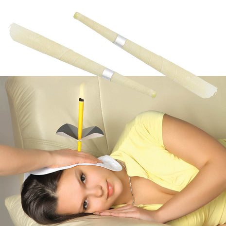 Woman lying on a couch with a headband and candles, possibly for relaxation or meditation.