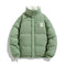 Green puffer jacket with a logo on a white background