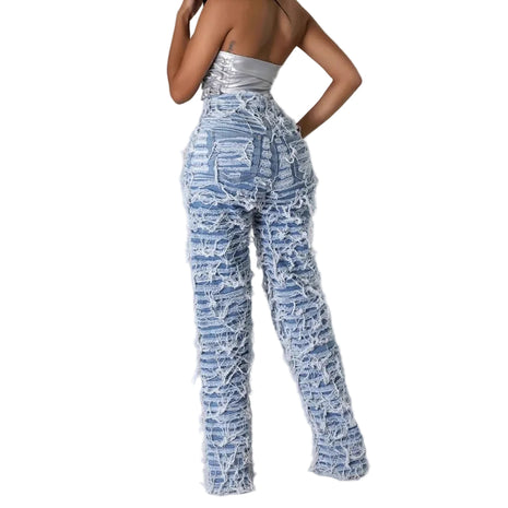Loose fit women’s denim pants featuring ripped details, tassel edging, and comfortable cotton fabric.