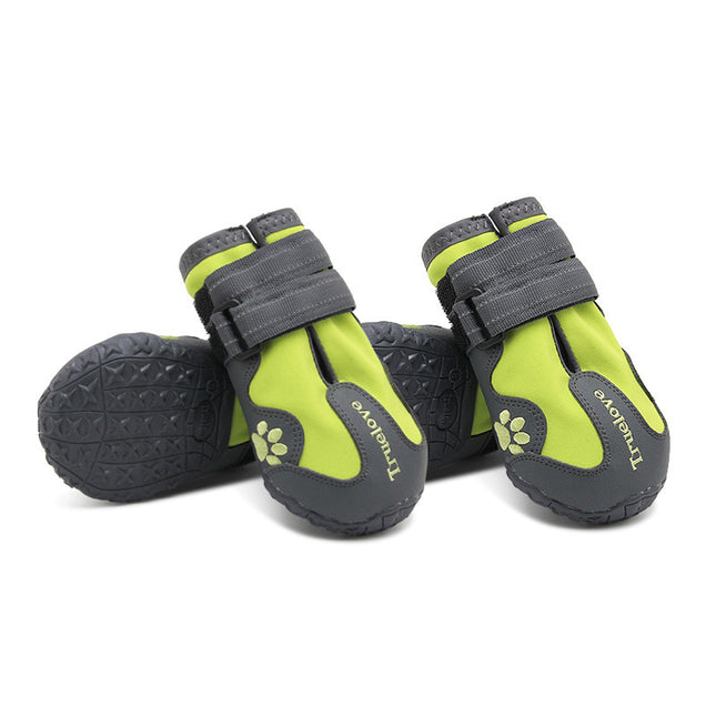 Pair of green and gray pet boots with paw design on a white background