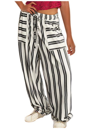 Black and white striped pants worn by a person on a white background blndl