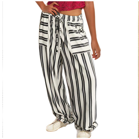 Black and white striped pants worn by a person on a white background blndl