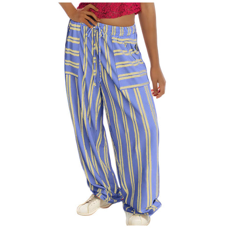 Blue and yellow striped pants worn by a person on a white background blndl